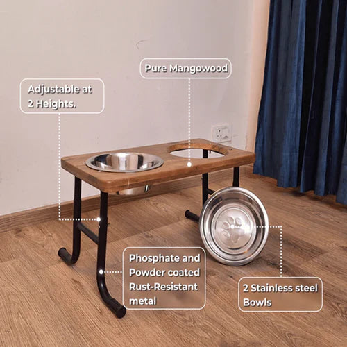 Wooden pet feeding station raised pet feeder India with stainless steel bowls on a wooden floor.